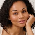 Woman dark hair looking into camera